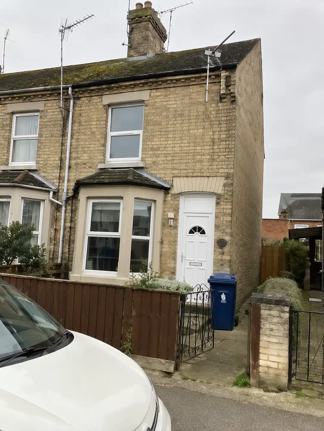 Front elevation of 15 Darthill Road, March, before refurbishment - 1914 mid-terrace house with bay window and structural movement to the side wall